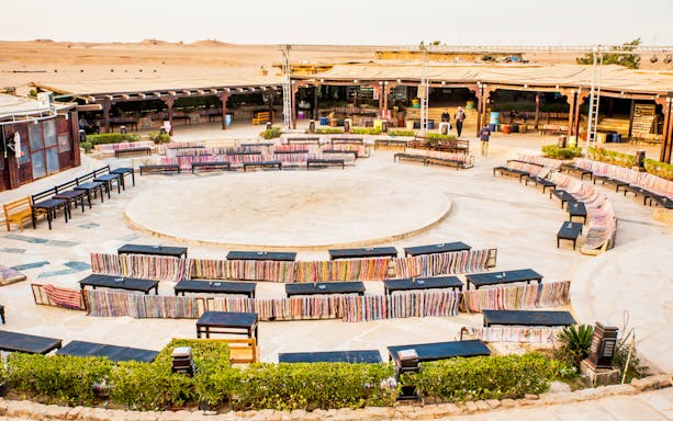 Outdoor seating area in Hurghada desert for quad bike safari and camel ride tour.