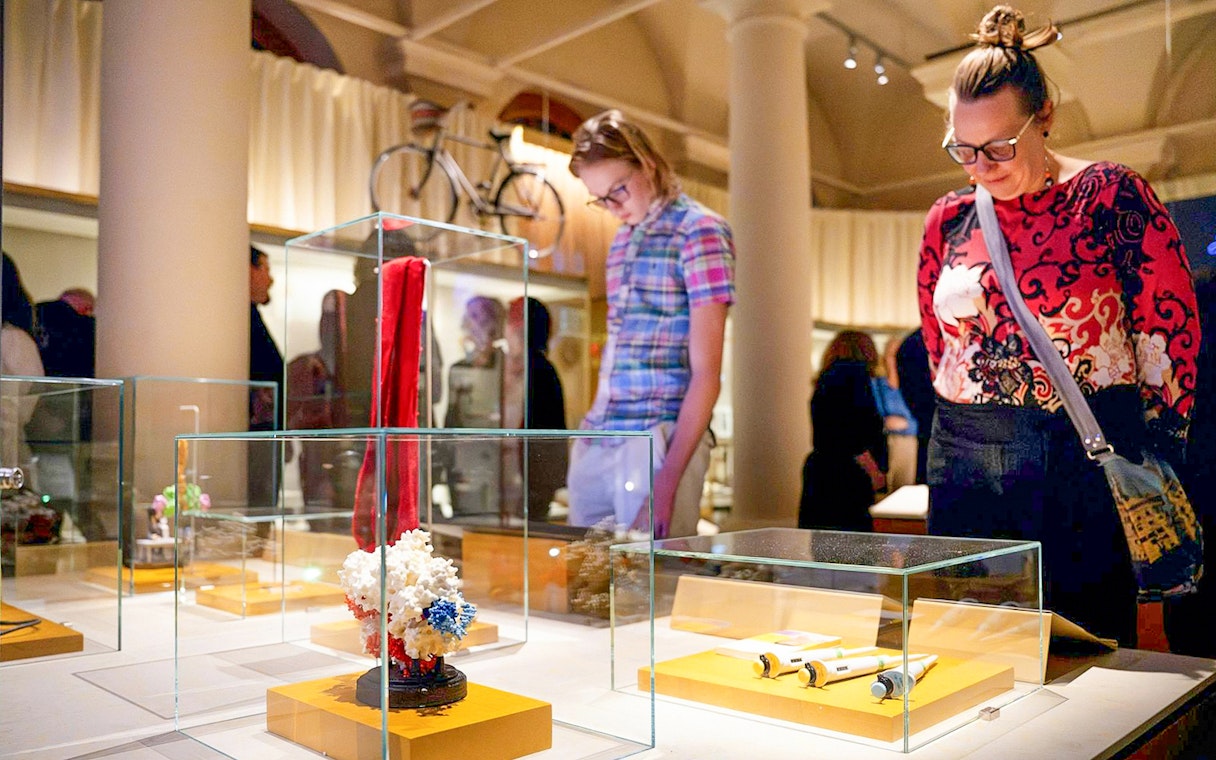 Visitors observing exhibits at the Nobel Prize Museum in Stockholm.