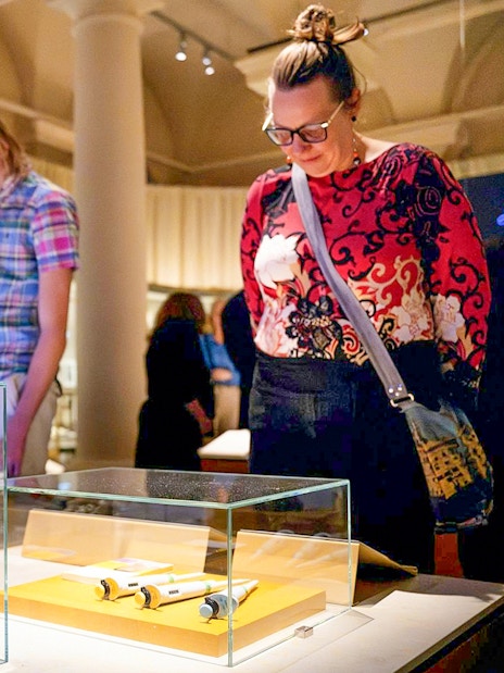 Visitors observing exhibits at the Nobel Prize Museum in Stockholm.