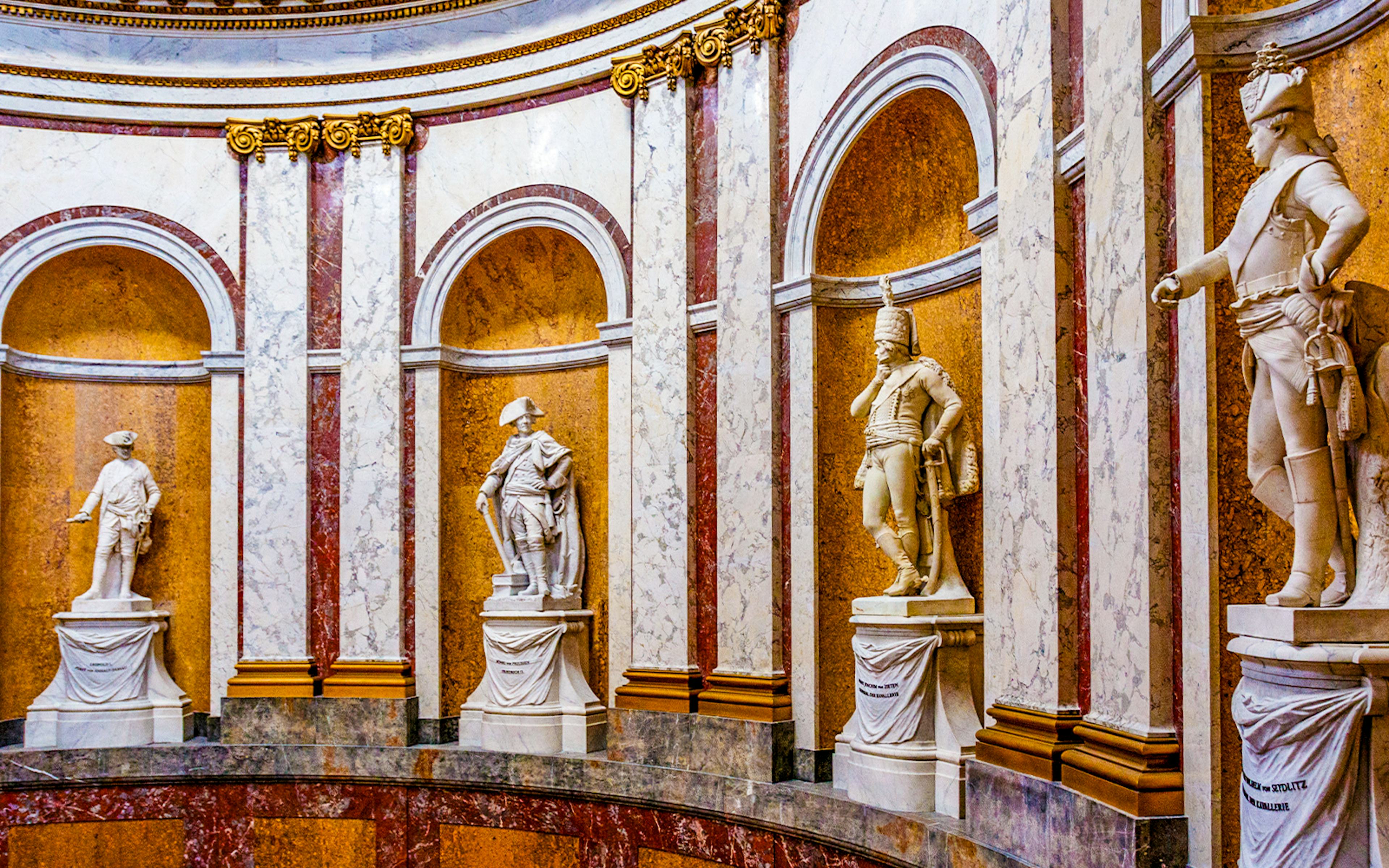Statues in the Bode Museum on Museum Island, Berlin, Germany, showcasing classical sculptures.