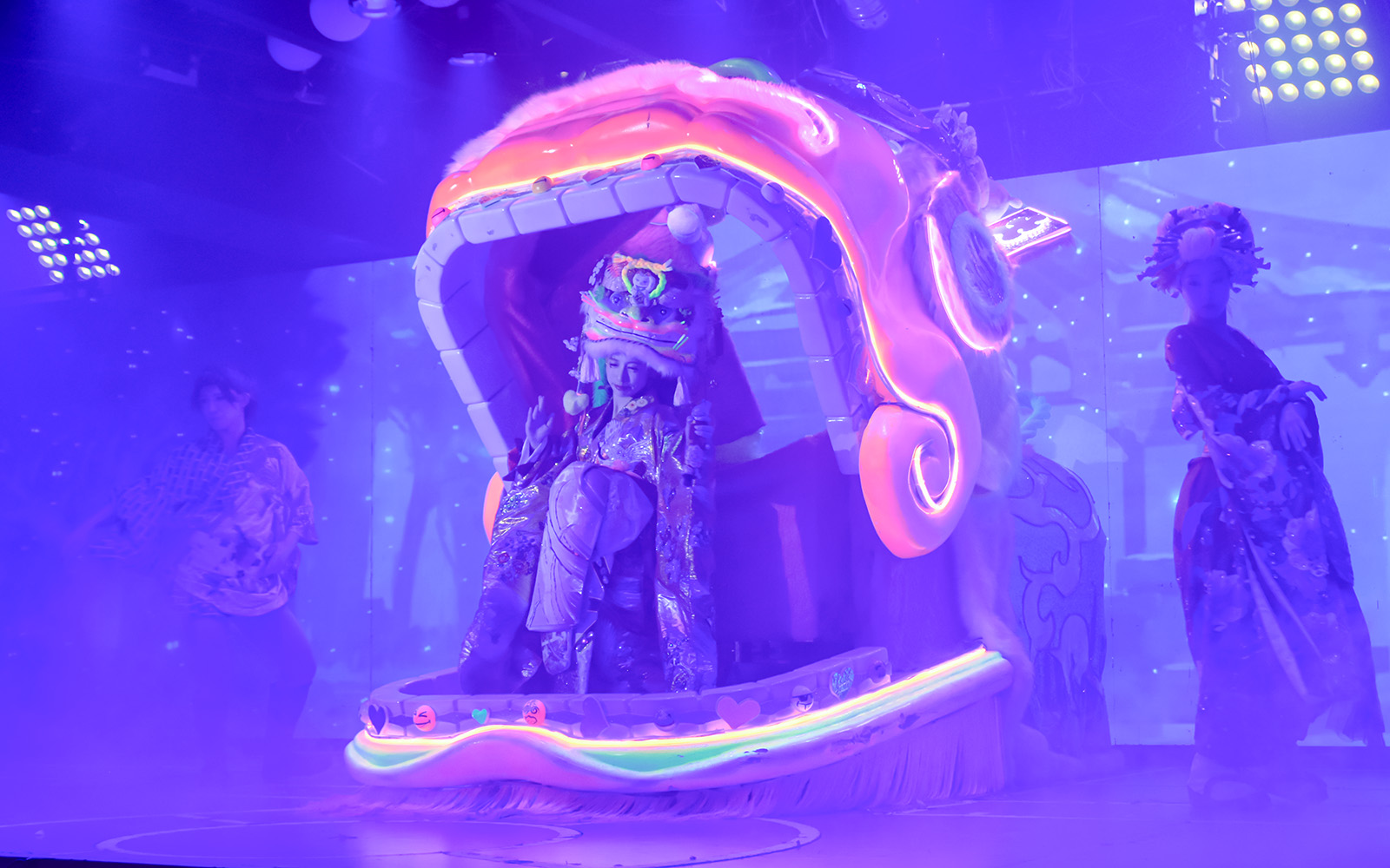 Performer in traditional attire on stage at Samurai Restaurant Show, Tokyo.