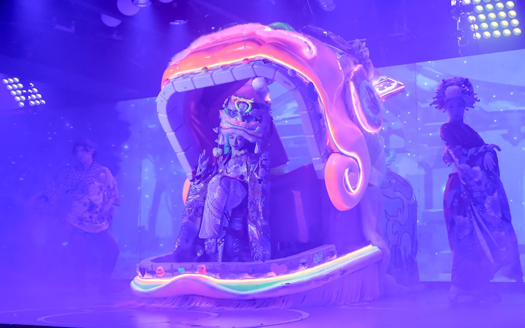 Performer in traditional attire on stage at Samurai Restaurant Show, Tokyo.