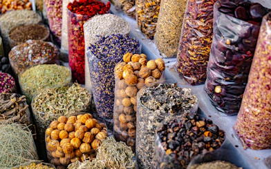 Spices and herbs displayed in bags at Souq Muttrah, Muscat, Oman.