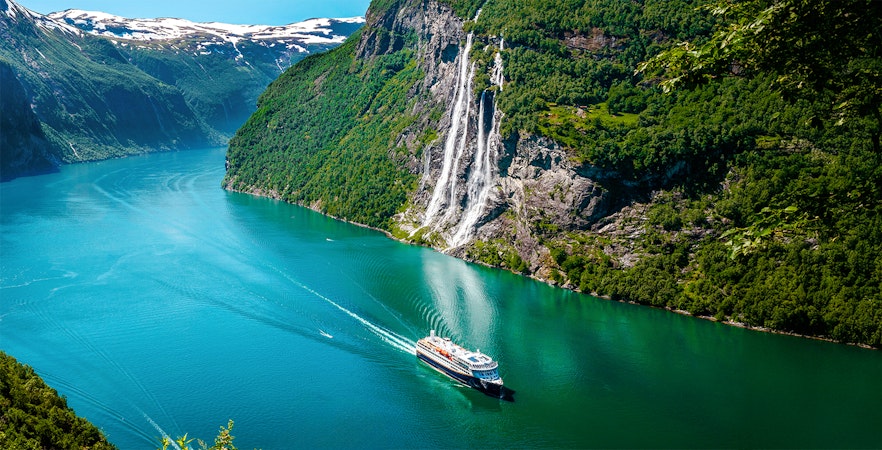 Cruise ship near Seven Sisters waterfall in Geirangerfjord, Norway.
