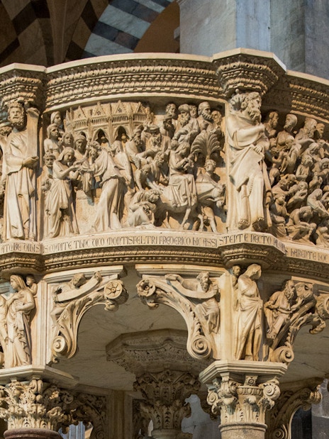 Pisa Cathedral pulpit with detailed carvings, part of the audio guide tour.