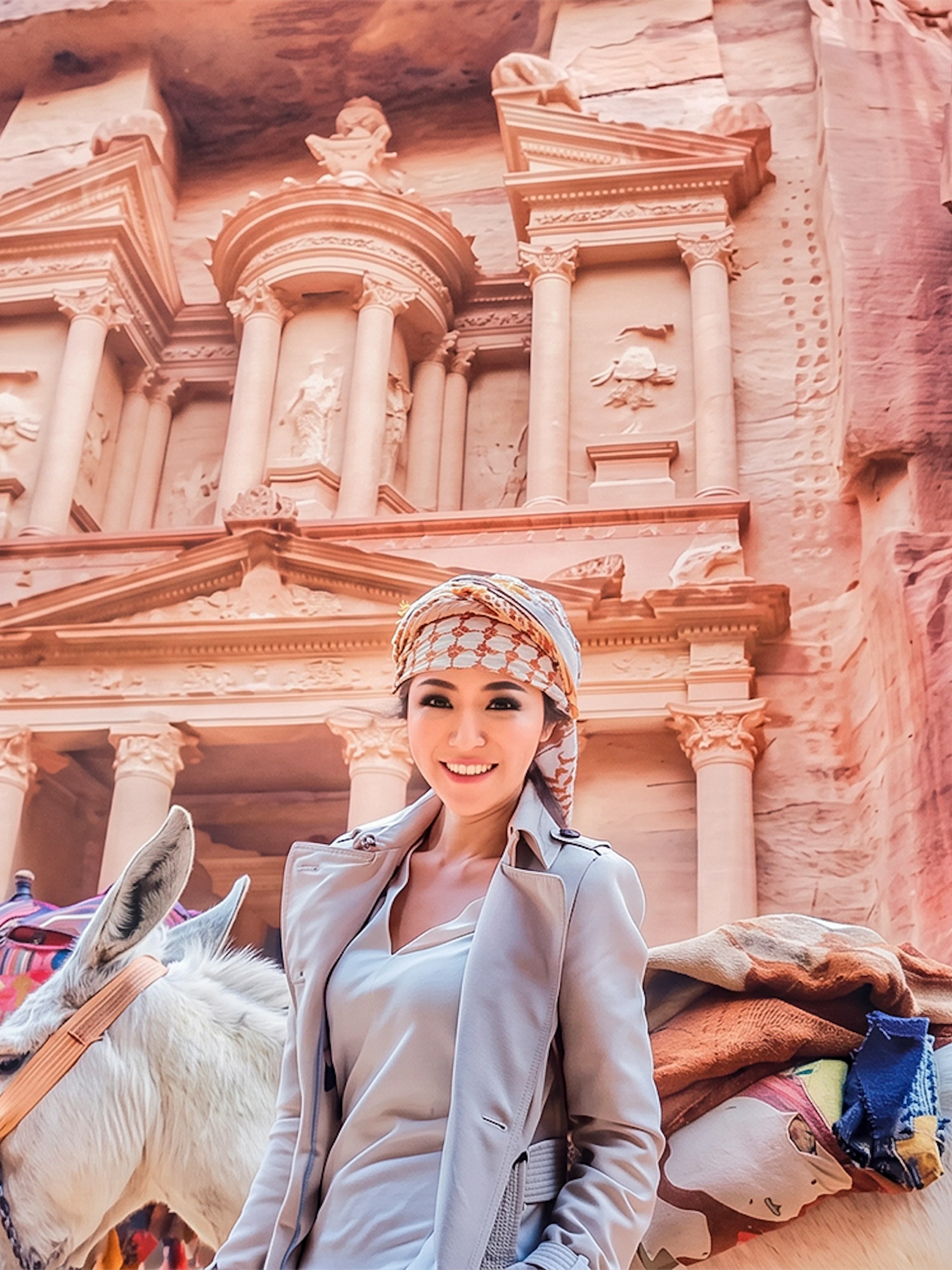 Tourist with camels at Petra's Al-Khazneh, Jordan, during a 2-day tour from Amman.