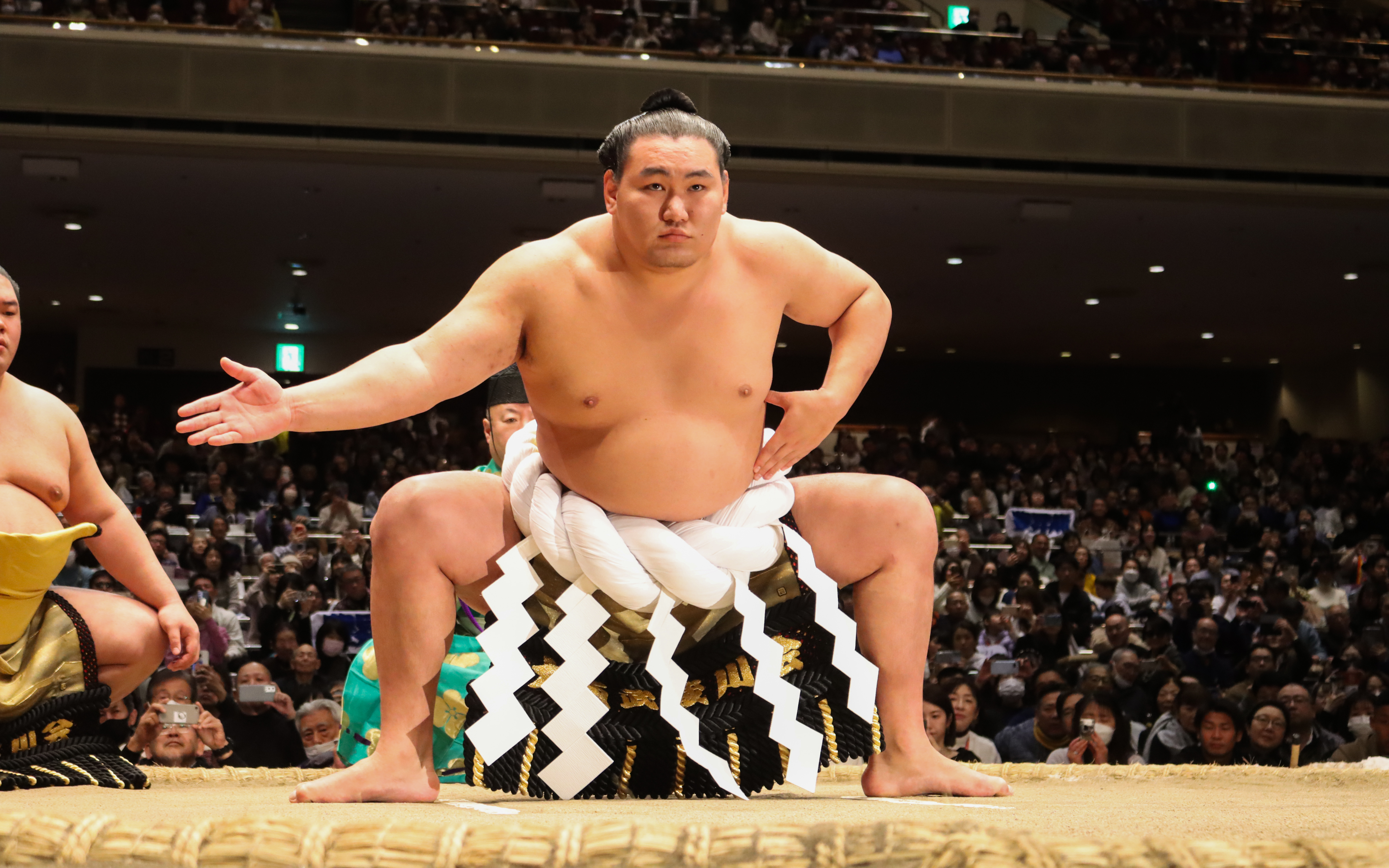 Sumo wrestler preparing for a match at Nagoya Grand Sumo Tournament.