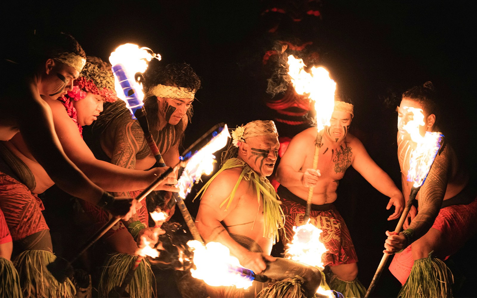 Fire dancers performing at Chief's Luau, Oahu, Hawaii.