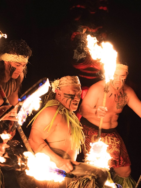 Fire dancers performing at Chief's Luau, Oahu, Hawaii.