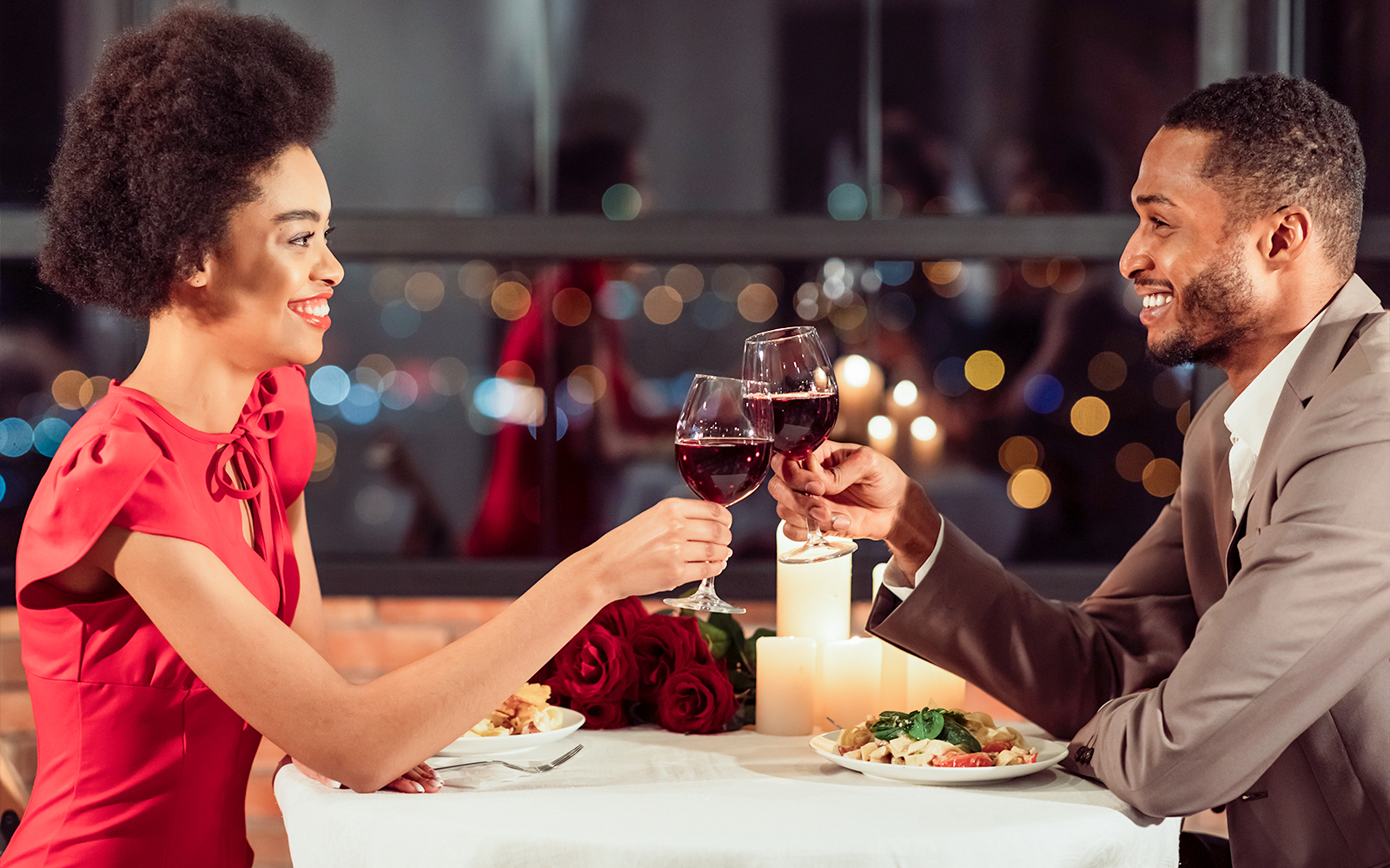 Couple toasting with wine at Opéra-Grand Café Capucines, Paris.
