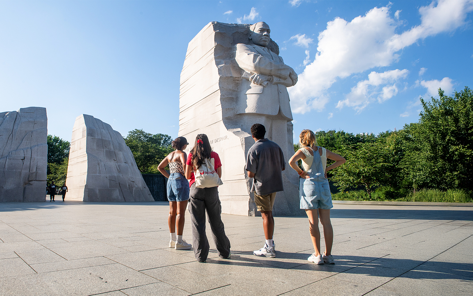 Visitors at Martin Luther King Jr. Memorial in Washington DC during electric cart tour.