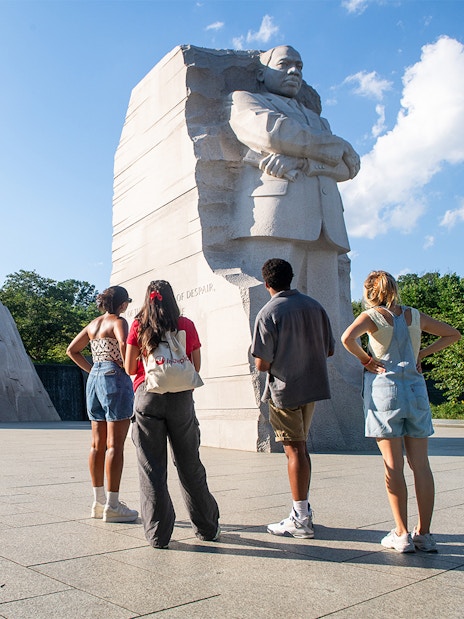 Visitors at Martin Luther King Jr. Memorial in Washington DC during electric cart tour.