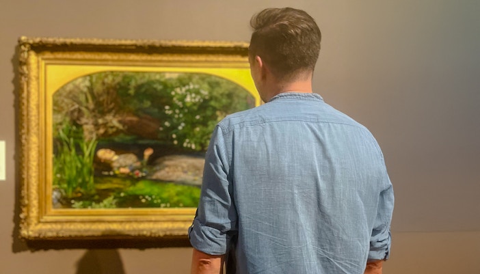 Visitor viewing painting during Tate Britain Discovery Tour.