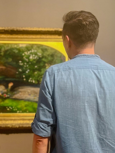 Visitor viewing painting during Tate Britain Discovery Tour.