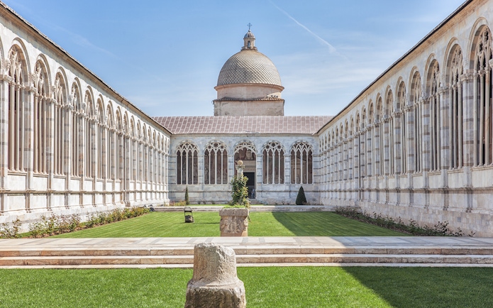 Camposanto Monumentale courtyard with arches, Pisa Cathedral Square, Italy.