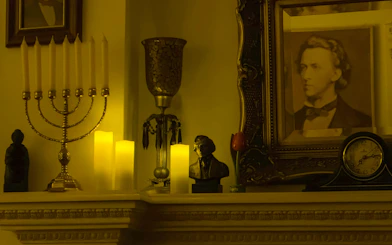 Chopin portrait and bust on a mantel with candles, Chopin Gallery, Krakow.