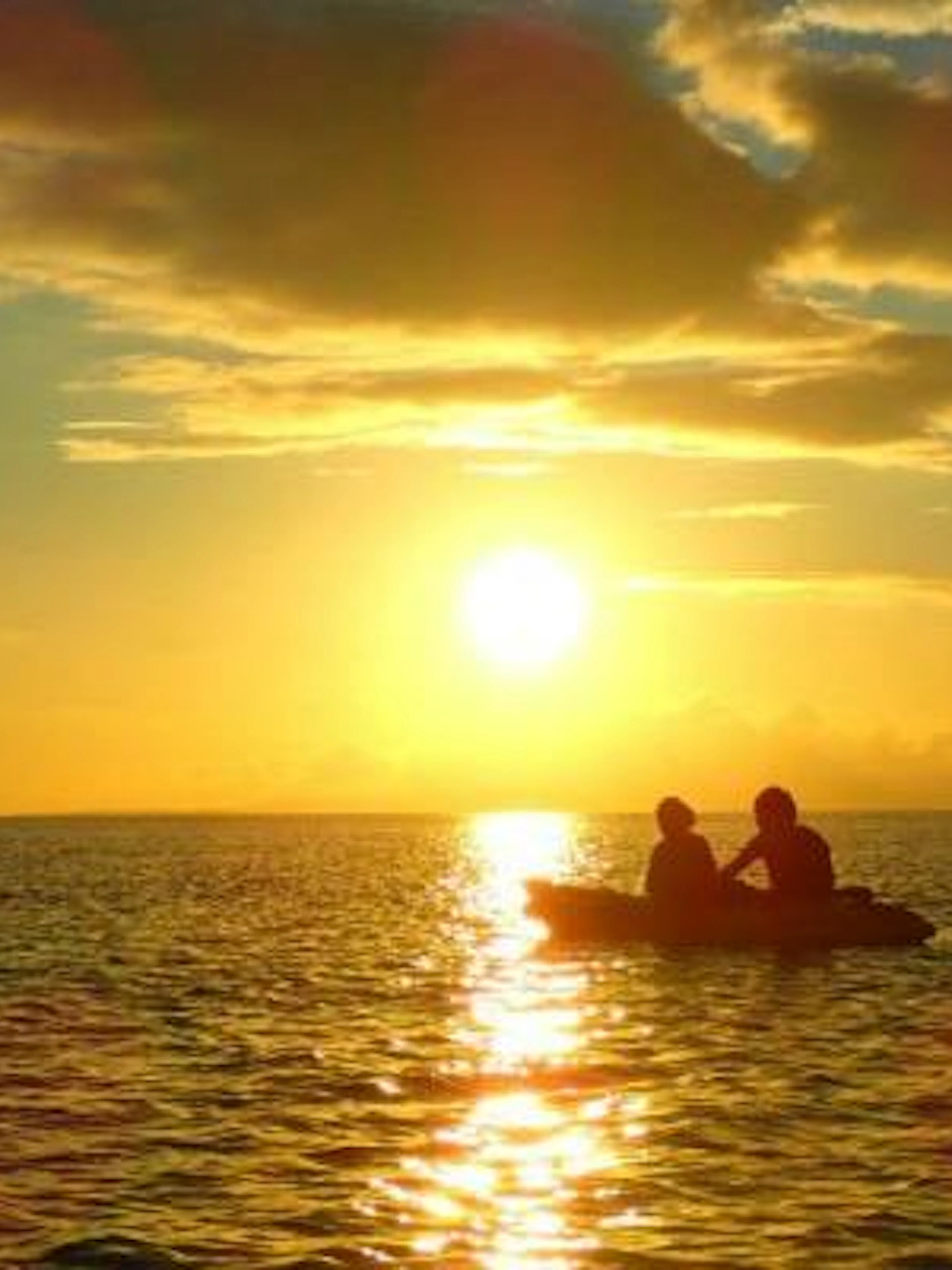Kayakers on Iriomote Island at sunset, Okinawa.