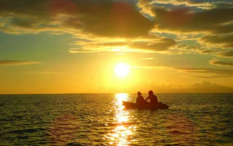 Kayakers on Iriomote Island at sunset, Okinawa.