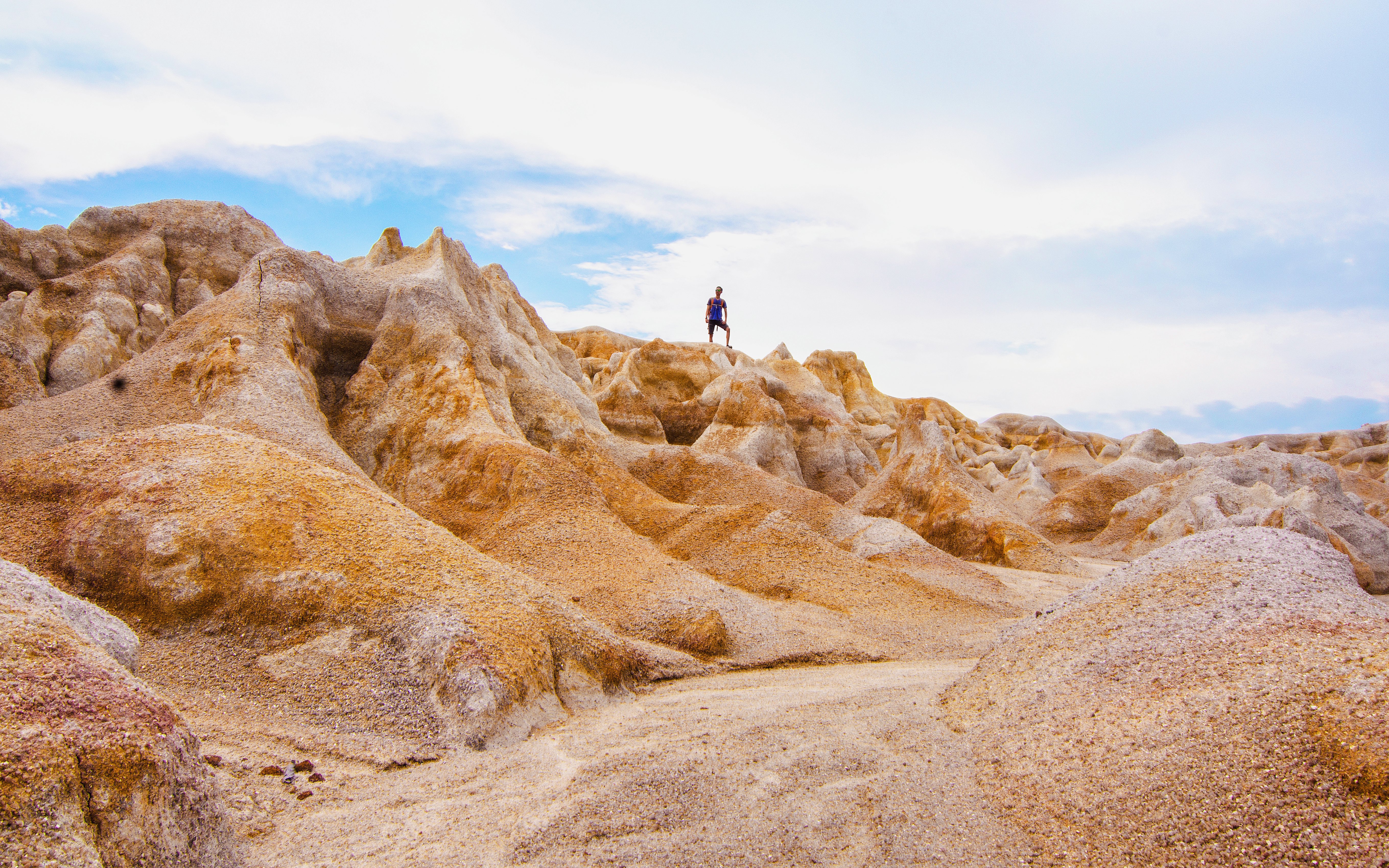 Person standing on rocky terrain in the mini desert of Bintan.
