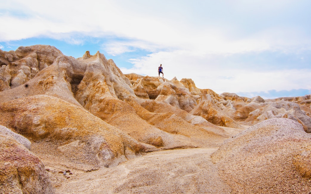 Person standing on rocky terrain in the mini desert of Bintan.