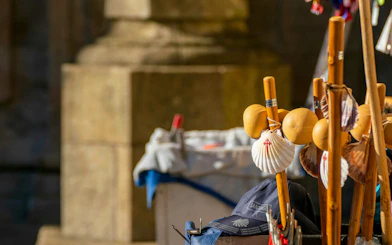 Pilgrim walking sticks with scallop shells at Santiago Cathedral.