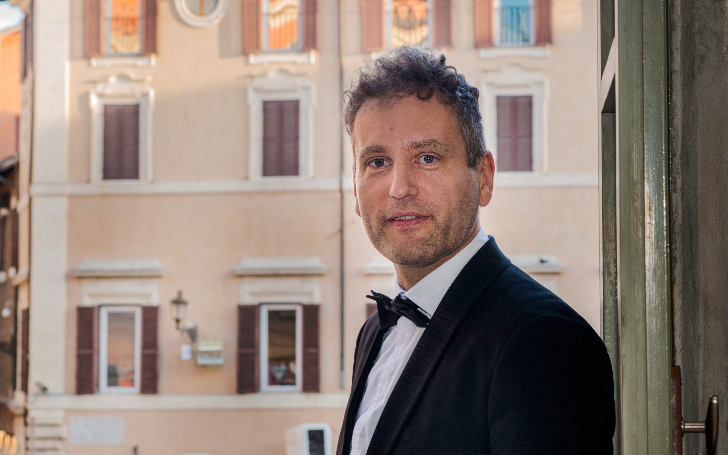 Opera singer in formal attire at Palazzo Poli, near Fontana di Trevi, Rome.