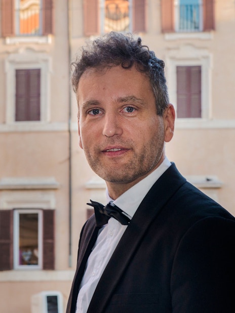 Opera singer in formal attire at Palazzo Poli, near Fontana di Trevi, Rome.