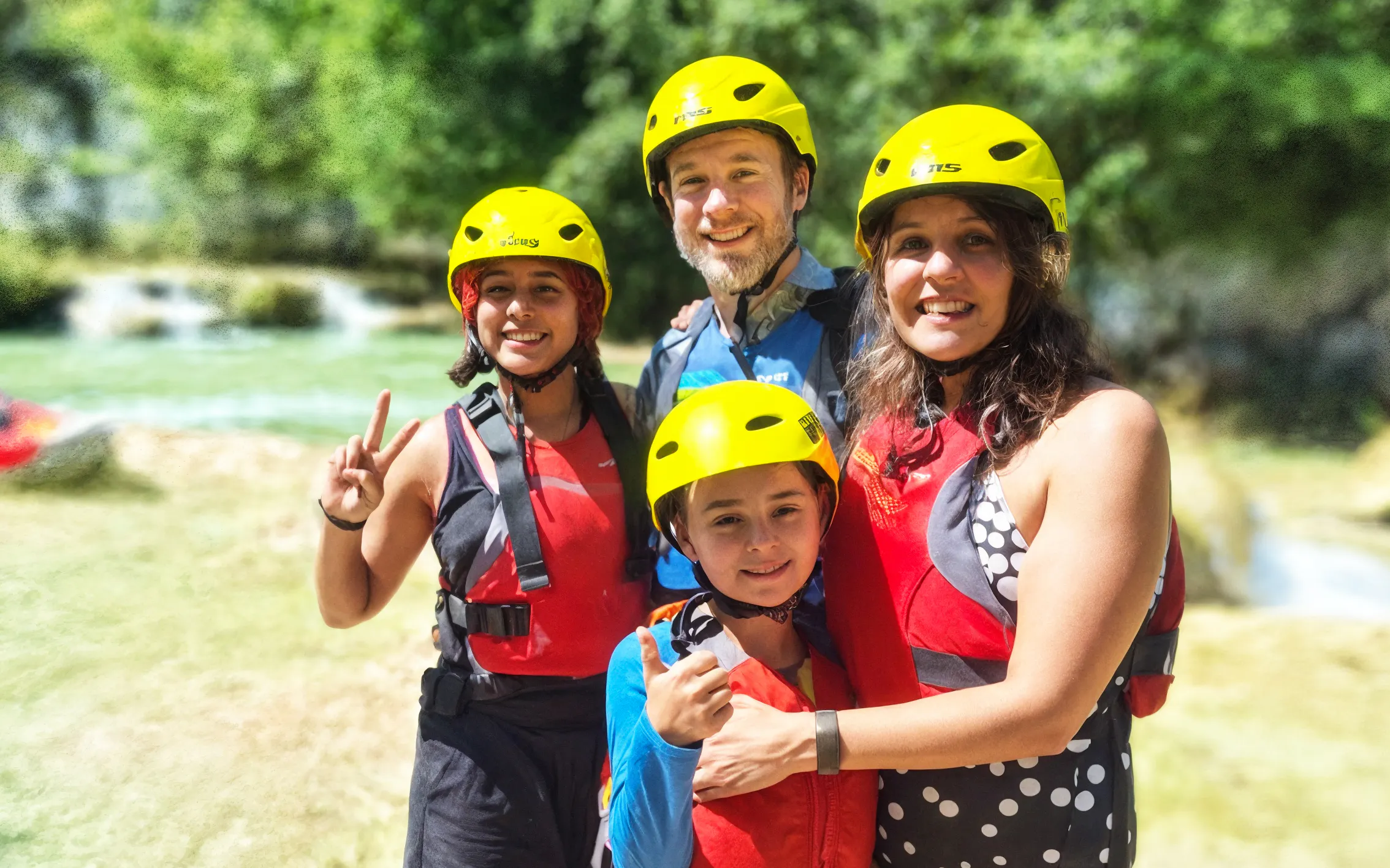 Family enjoying rafting at Mrežnica Canyon Waterfalls, Split.