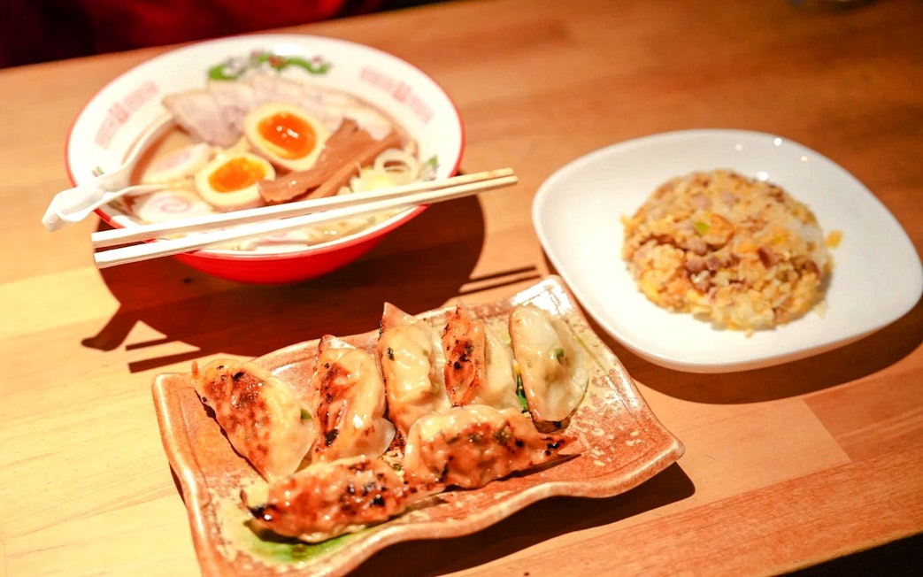Ramen with soft-boiled eggs, gyoza, and fried rice served in a Kyoto cooking class.