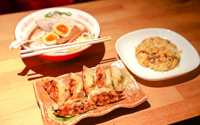 Ramen with soft-boiled eggs, gyoza, and fried rice served in a Kyoto cooking class.