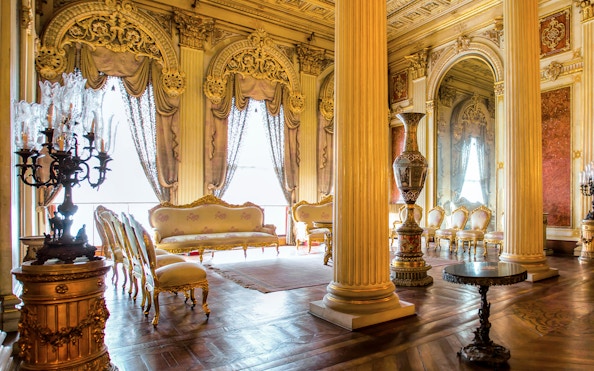 Elegant interior of Sufera Hall, Dolmabahçe Palace, Istanbul, featuring ornate columns and luxurious furnishings.