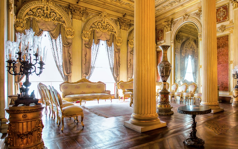Elegant interior of Sufera Hall, Dolmabahçe Palace, Istanbul, featuring ornate columns and luxurious furnishings.