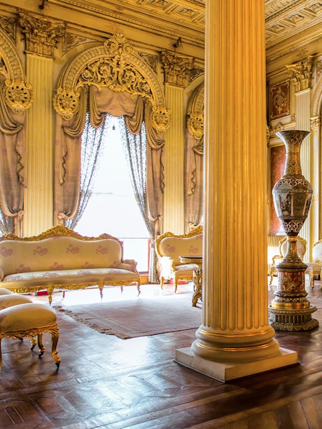 Elegant interior of Sufera Hall, Dolmabahçe Palace, Istanbul, featuring ornate columns and luxurious furnishings.