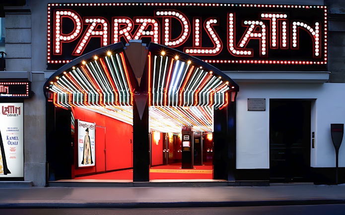 Paradis Latin entrance with illuminated marquee in Paris.