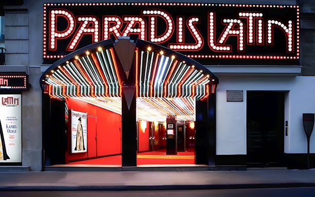 Paradis Latin entrance with illuminated marquee in Paris.