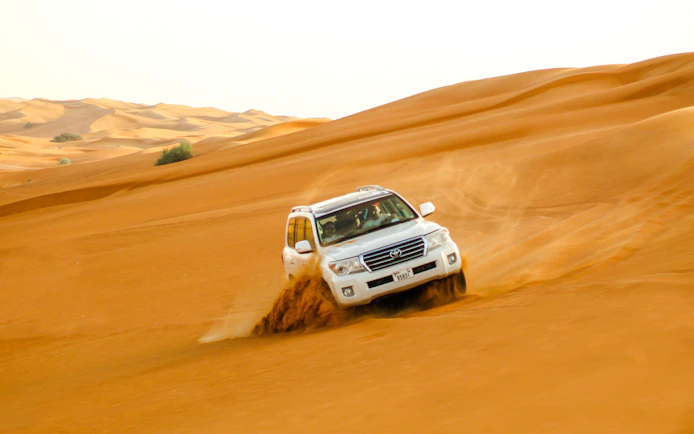 Dubai Morning Desert Safari with Dune Bashing, Sandboarding and Camel Ride