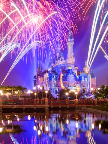 Sleeping Beauty Castle with fireworks at night, Disneyland Shanghai.