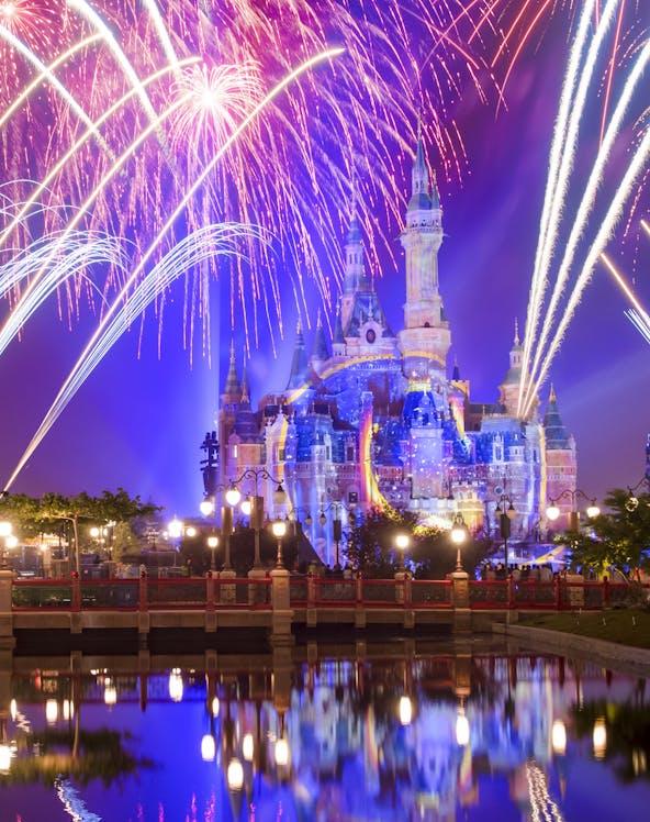 Sleeping Beauty Castle with fireworks at night, Disneyland Shanghai.