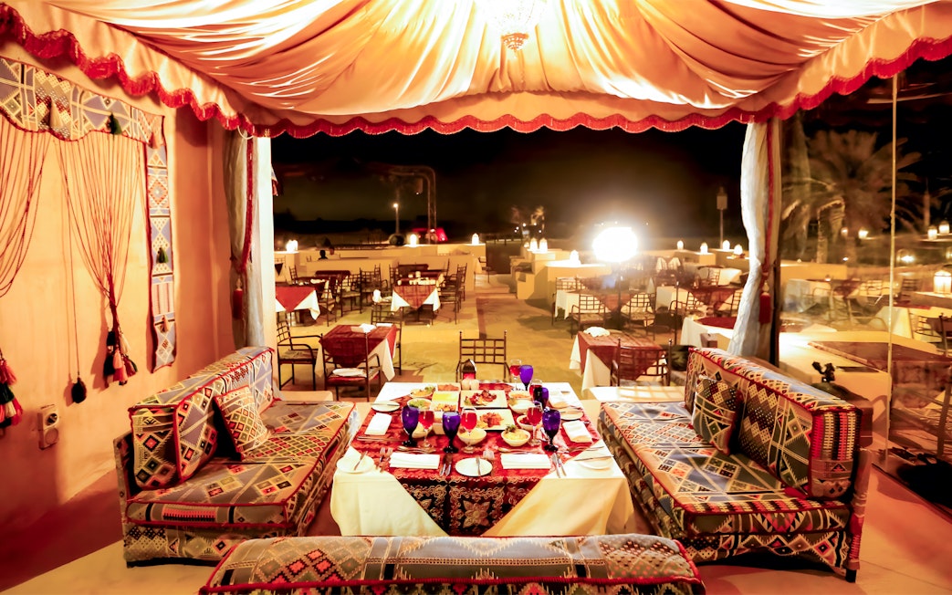 Royal dinner seating area with traditional decor in Dubai.