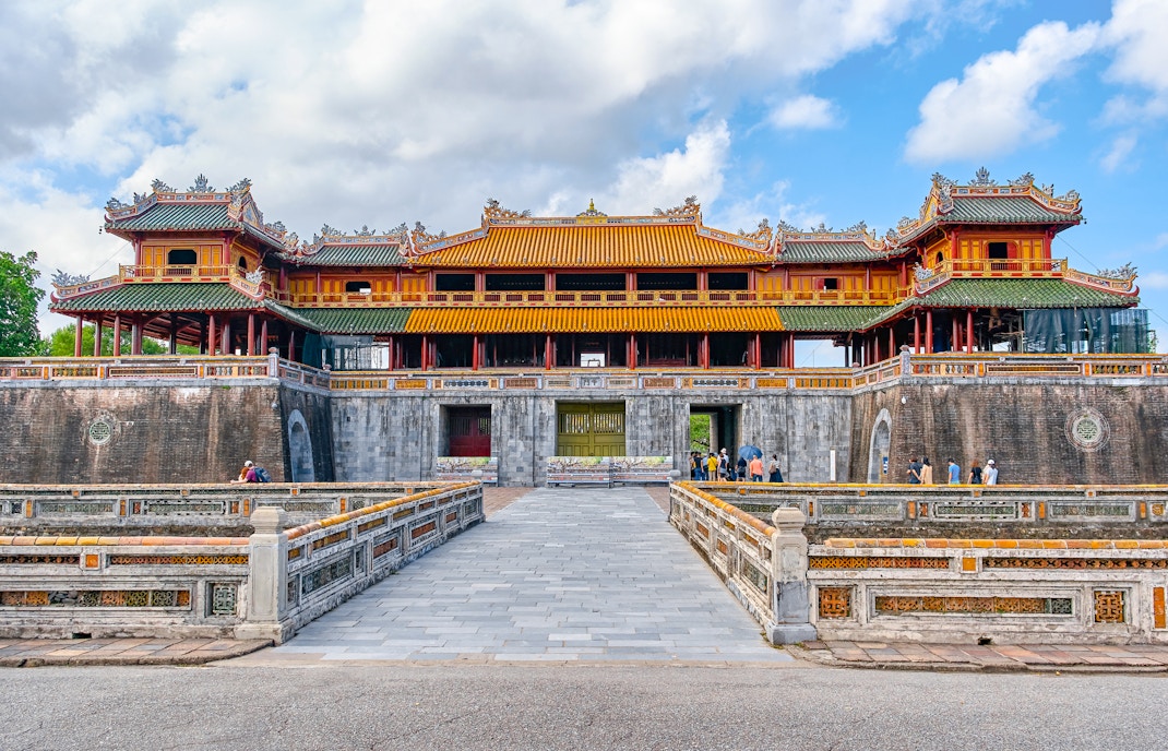 Imperial City gate with ornate architecture in Hue, Vietnam, a UNESCO World Heritage site.