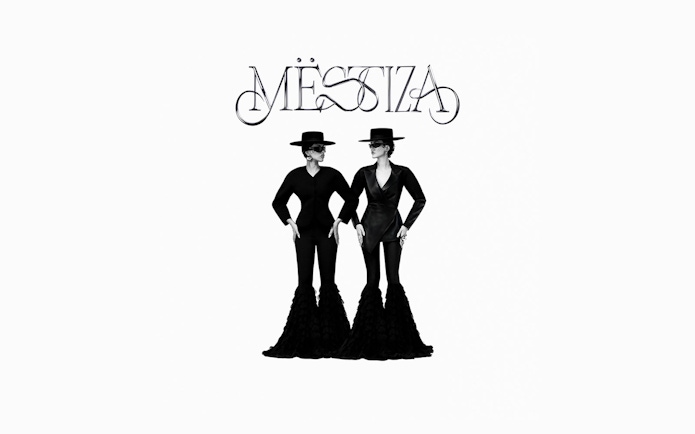 Two figures in black outfits and hats under the Mestiza logo, Ibiza.
