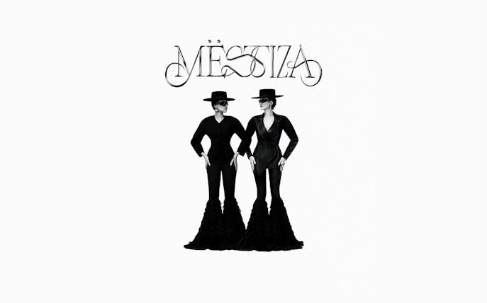 Two figures in black outfits and hats under the Mestiza logo, Ibiza.