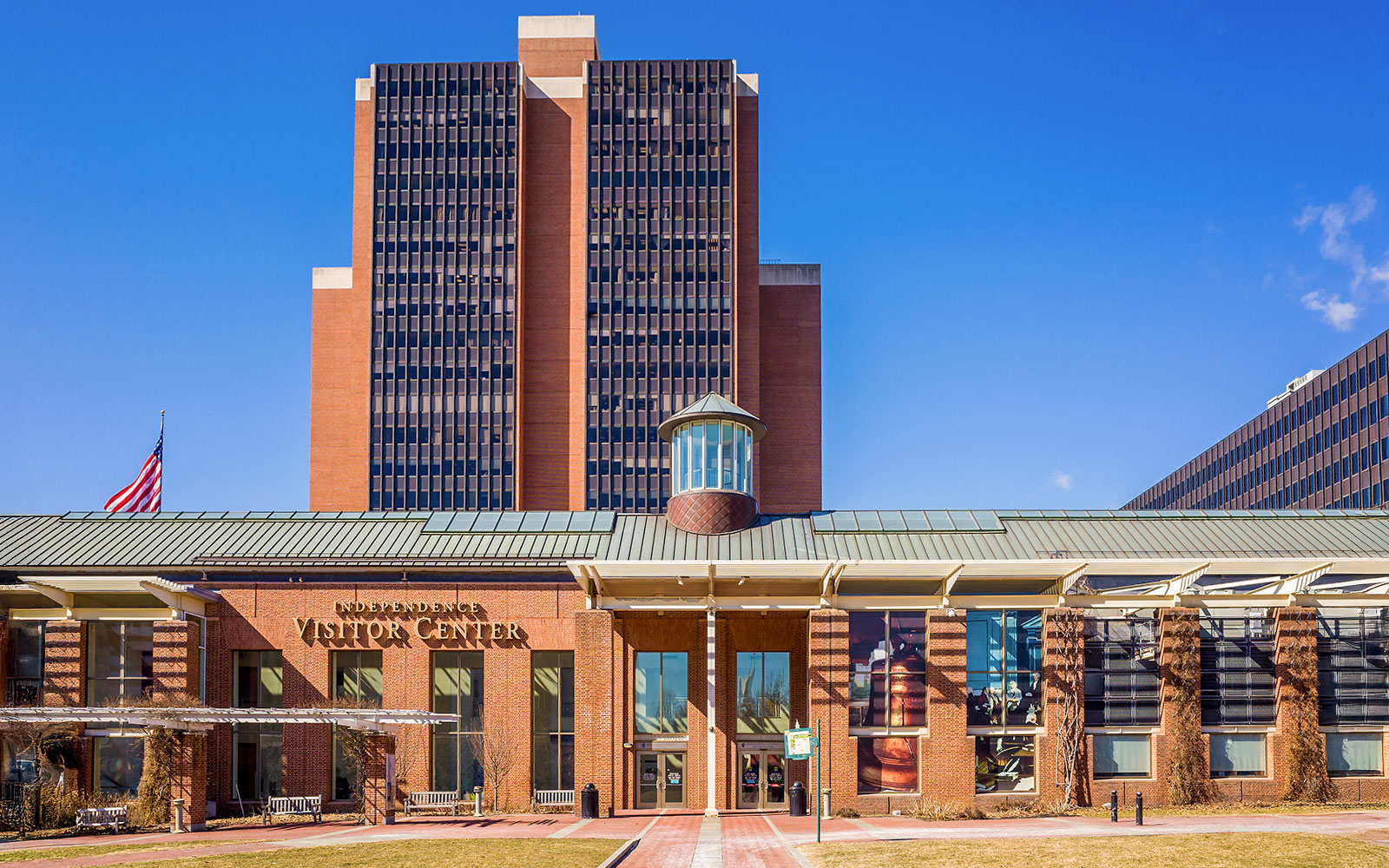 Philadelphia Independence Visitor Center with American flag and modern architecture.