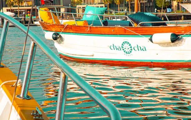 Boat docked at Dubai Marina during historical tour.