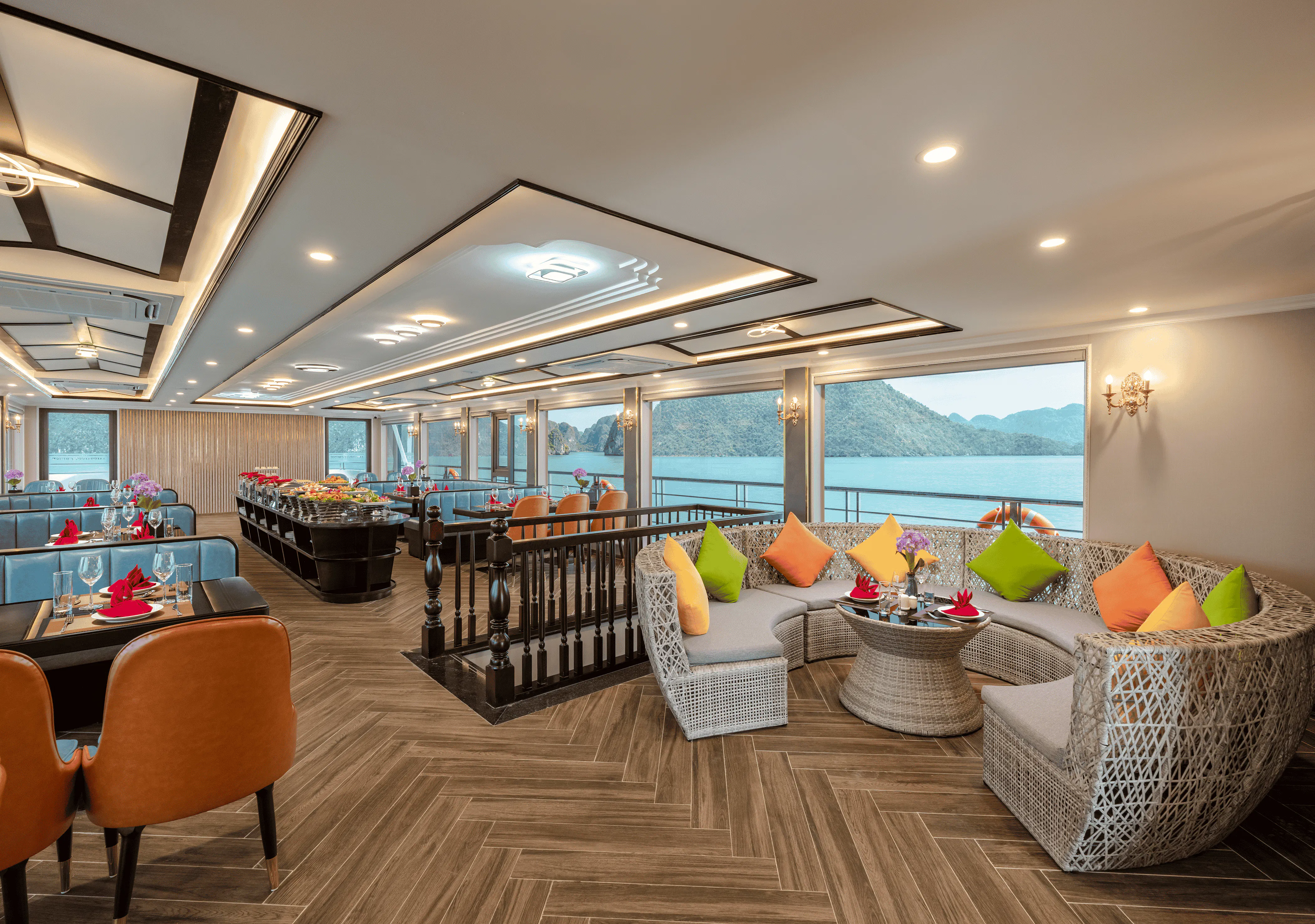 Luxurious dining area on Amethyst Cruise with Halong Bay view, featuring elegant seating and decor.