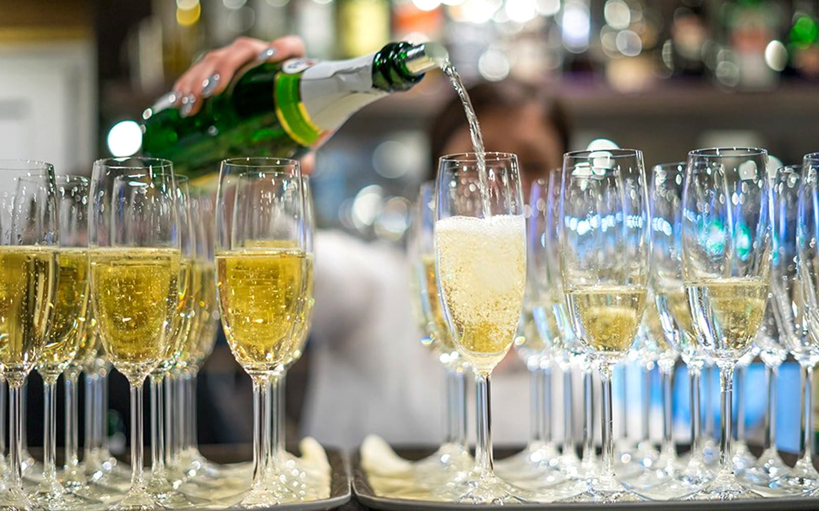 Champagne being poured into glasses during New Year’s Eve Gala Dinner Cruise.