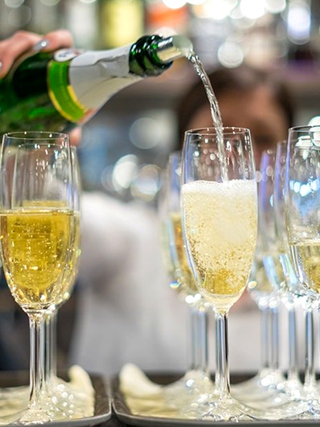 Champagne being poured into glasses during New Year’s Eve Gala Dinner Cruise.