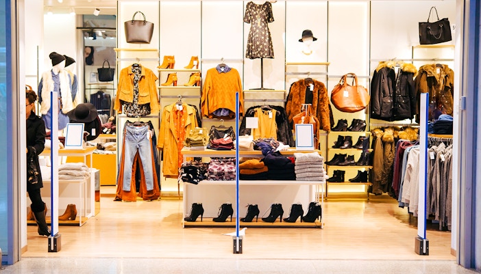 Fashion store display at Val d’Europe Shopping Center with clothing and accessories.