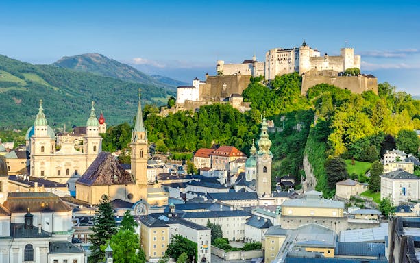 Hohensalzburg Fortress overlooking Salzburg cityscape, Austria.