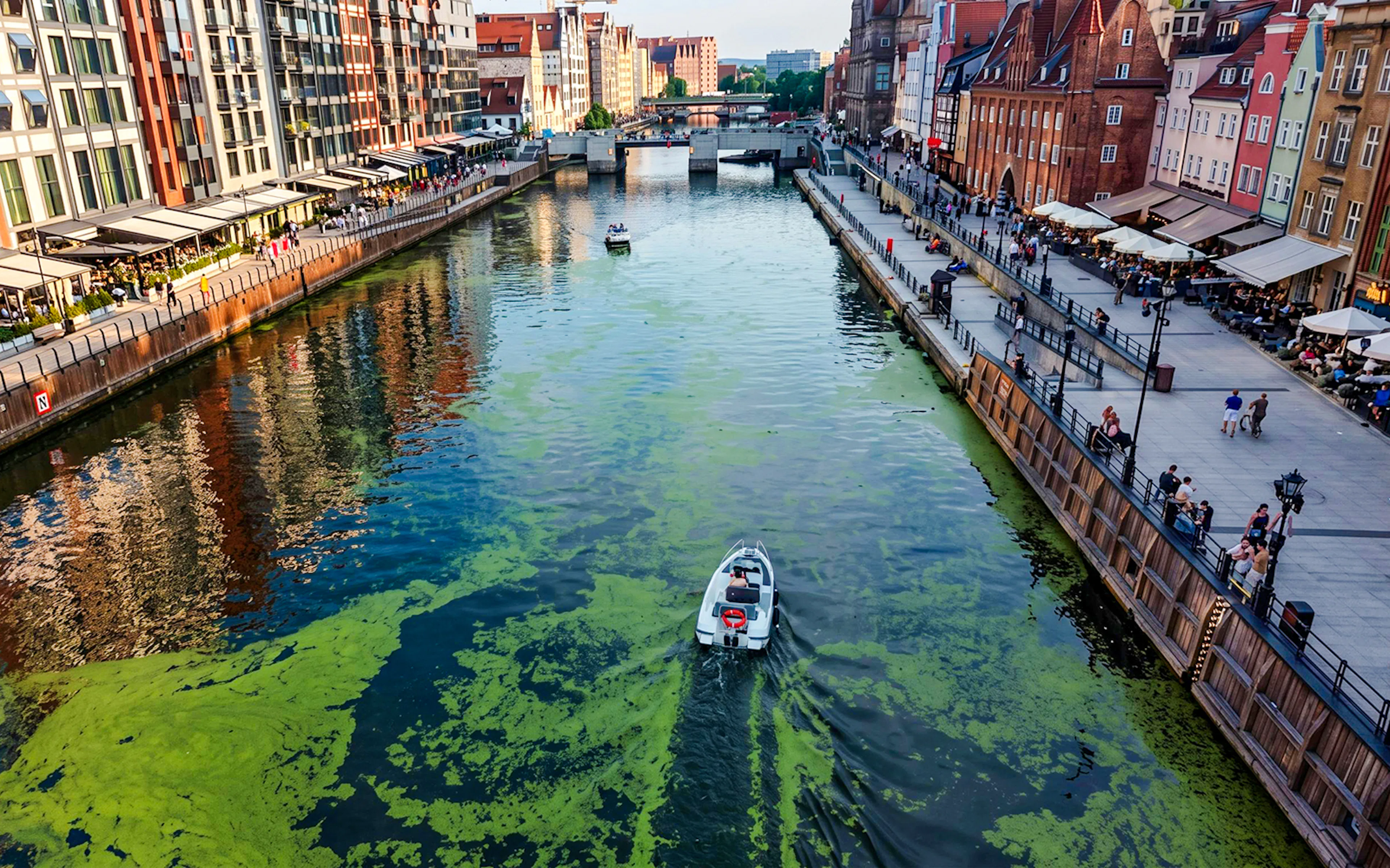 Electric boat cruising Gdansk harbour during Motława Sunset Cruise tour.